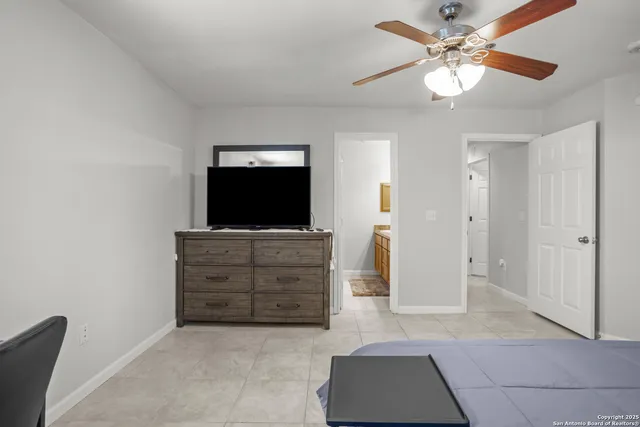 a view of room with cabinet and flat screen tv