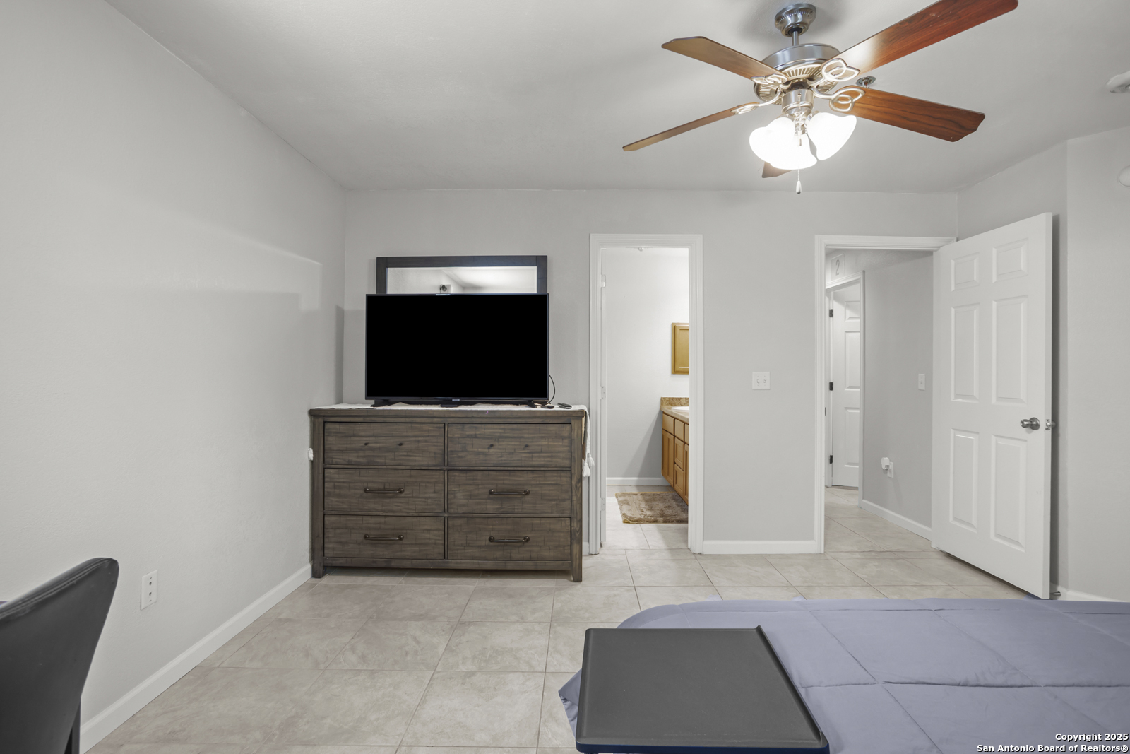 7323 Snowden Road, Unit 1102 San Antonio, TX 78229 - Photo 17 of 27 a view of room with cabinet and flat screen tv