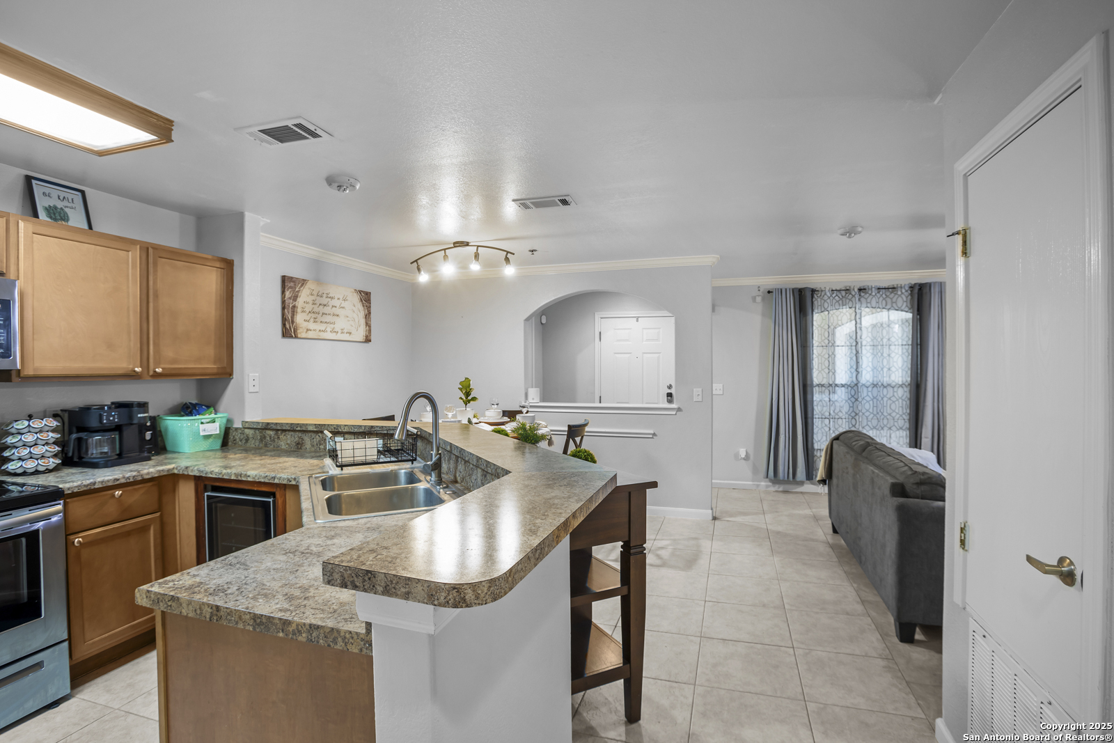 7323 Snowden Road, Unit 1102 San Antonio, TX 78229 - Photo 3 of 27 a kitchen with a sink stove and cabinets