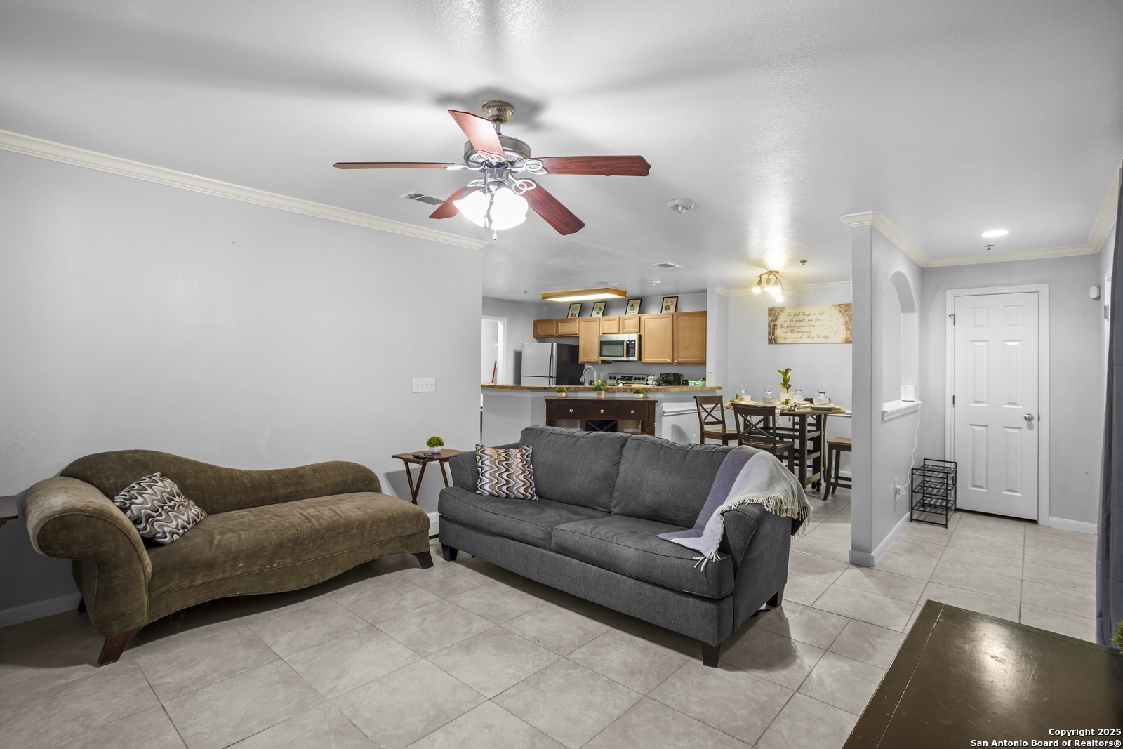 7323 Snowden Road, Unit 1102 San Antonio, TX 78229 - Photo 5 of 27 a living room with furniture and a view of kitchen