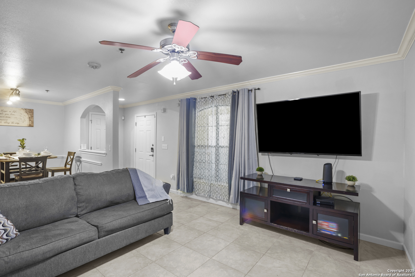 7323 Snowden Road, Unit 1102 San Antonio, TX 78229 - Photo 6 of 27 a living room with furniture and a flat screen tv