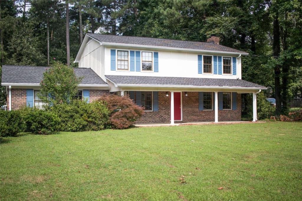 front view of a house with a yard