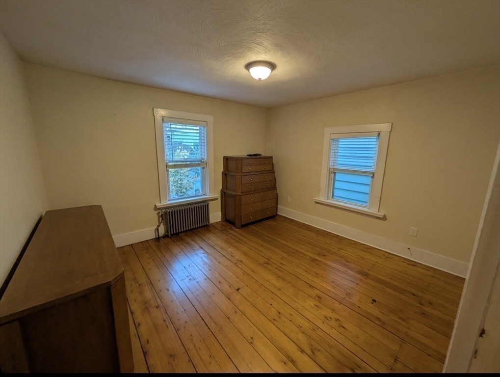 25 Sawin Street, Unit 25 Watertown, MA 02472 - Photo 15 of 22 a view of an empty room and wooden floor