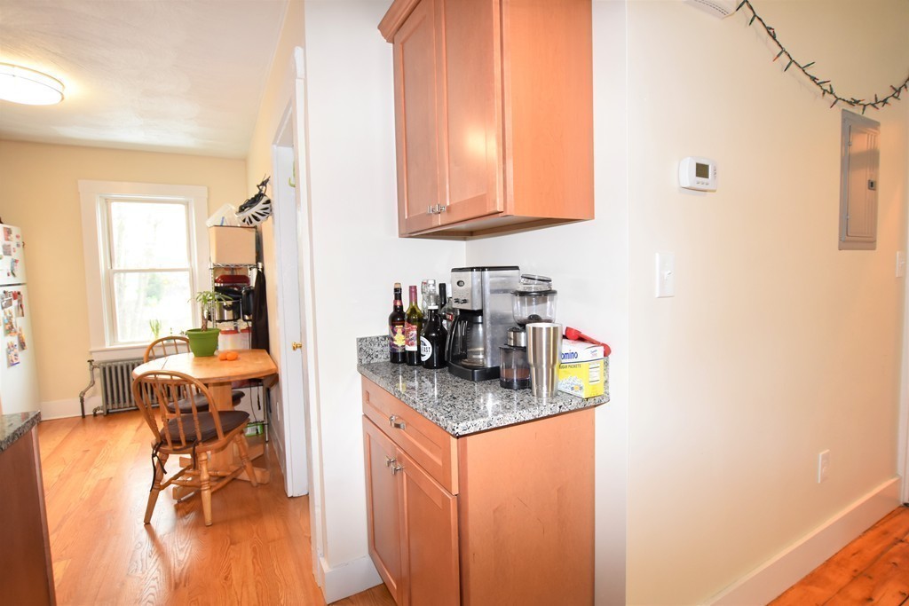 25 Sawin Street, Unit 25 Watertown, MA 02472 - Photo 7 of 22 a kitchen with a sink cabinets and window