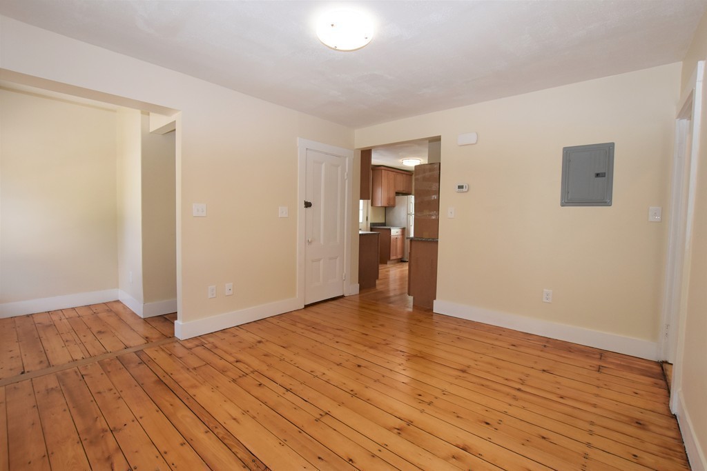 25 Sawin Street, Unit 25 Watertown, MA 02472 - Photo 8 of 22 a view of an empty room and wooden floor