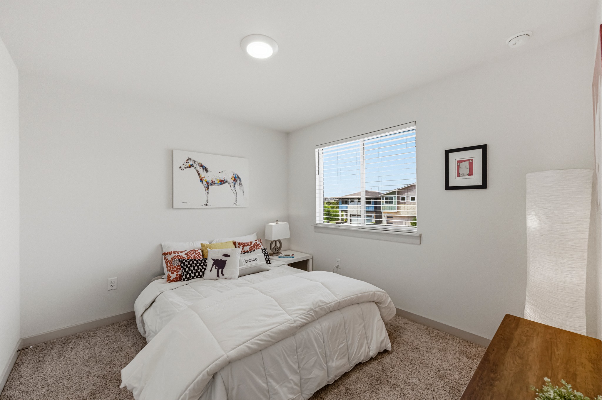 7511 Traylor Cove Austin, TX 78724 - Photo 25 of 40 a bedroom with a bed and a couch