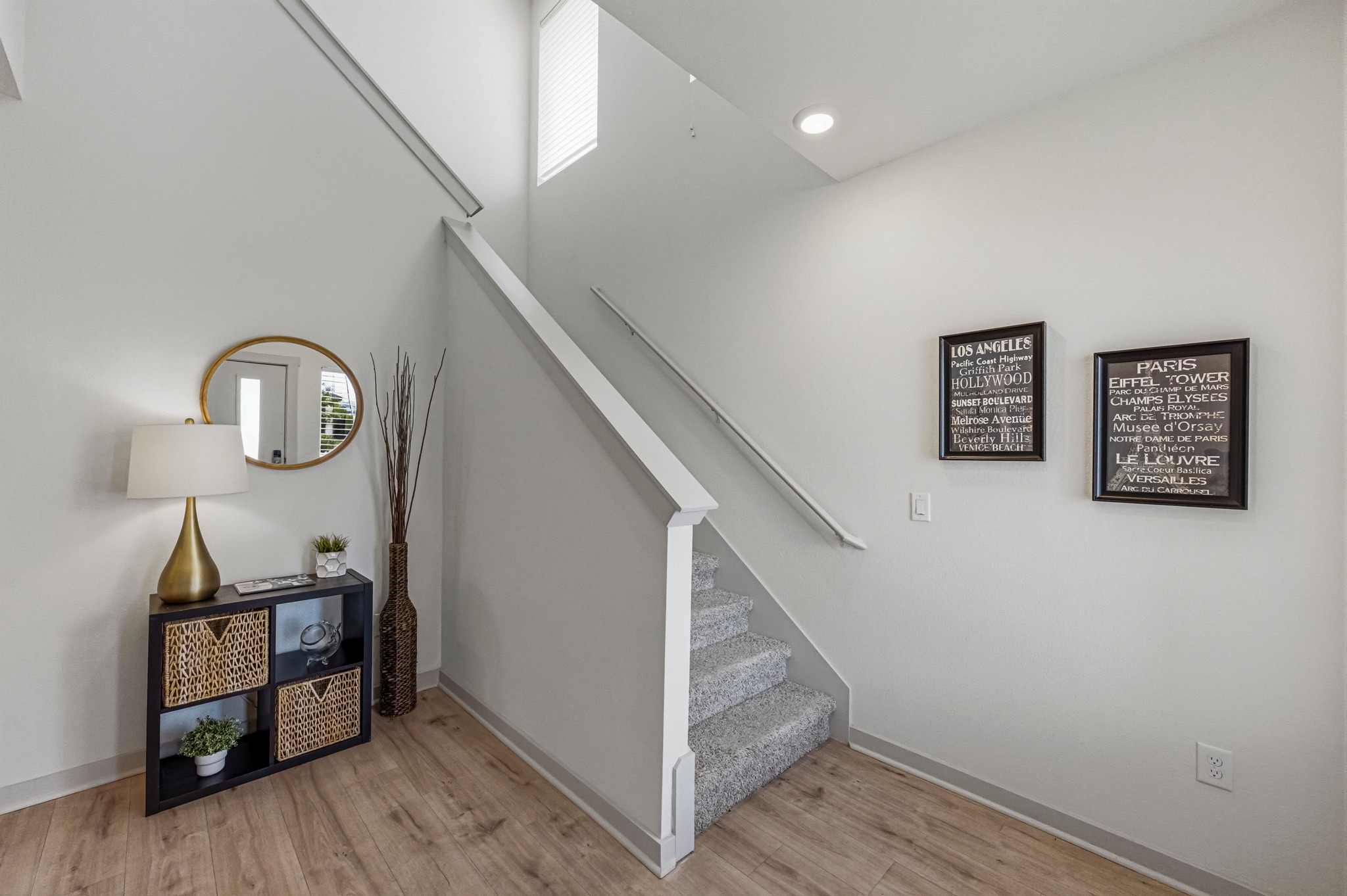 7511 Traylor Cove Austin, TX 78724 - Photo 28 of 40 a view of a hallway with wooden floor and staircase