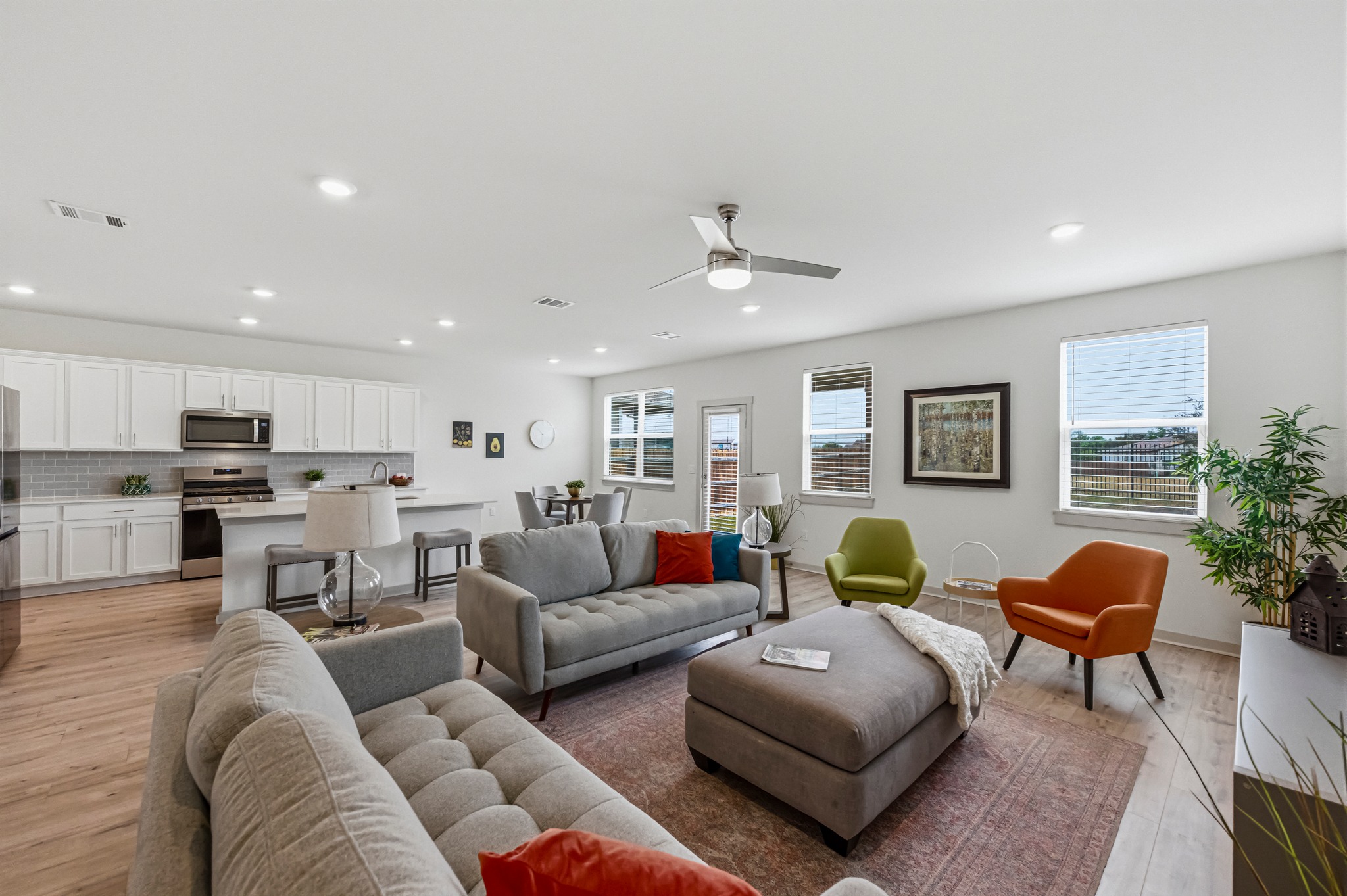 7511 Traylor Cove Austin, TX 78724 - Photo 3 of 40 a living room with furniture kitchen view and a potted plant