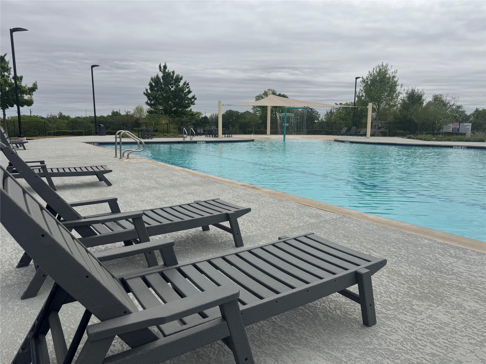 7511 Traylor Cove Austin, TX 78724 - Photo 32 of 40 Lounging by the Community Pool