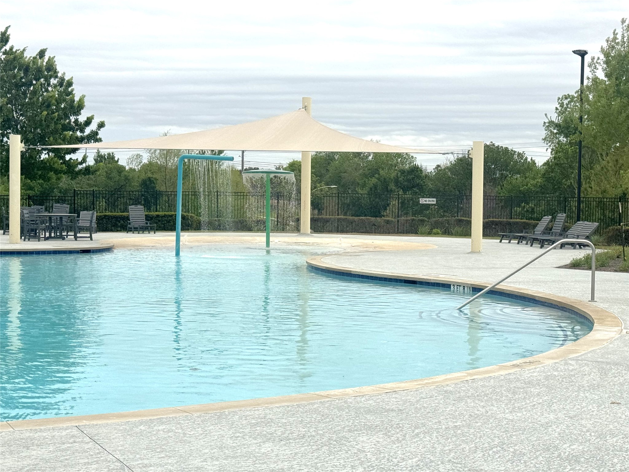 7511 Traylor Cove Austin, TX 78724 - Photo 37 of 40 Community pool with shade and water features