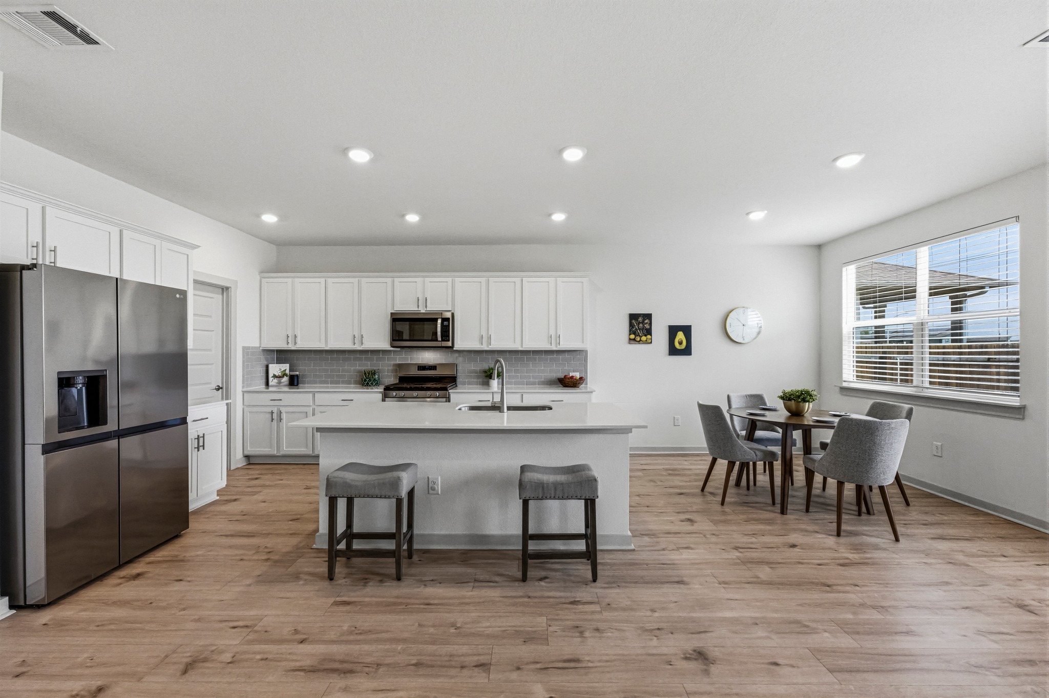 7511 Traylor Cove Austin, TX 78724 - Photo 7 of 40 a large kitchen with a table and chairs