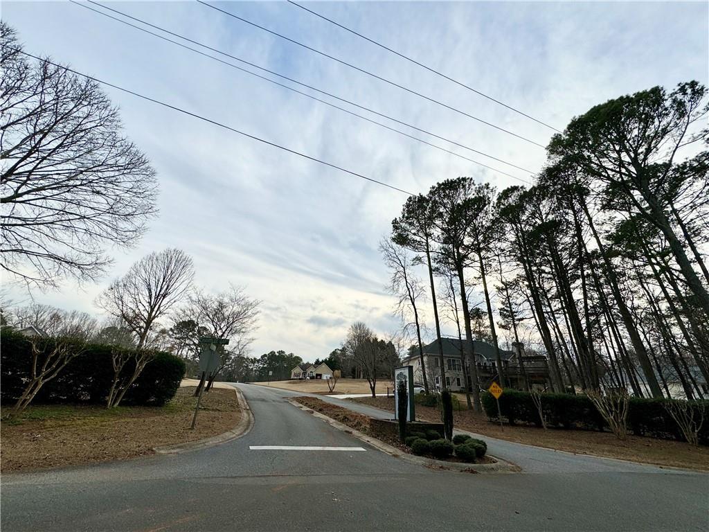 1680 Greystone Road Cumming, GA 30040 - Photo 5 of 9 a view of a street with a houses