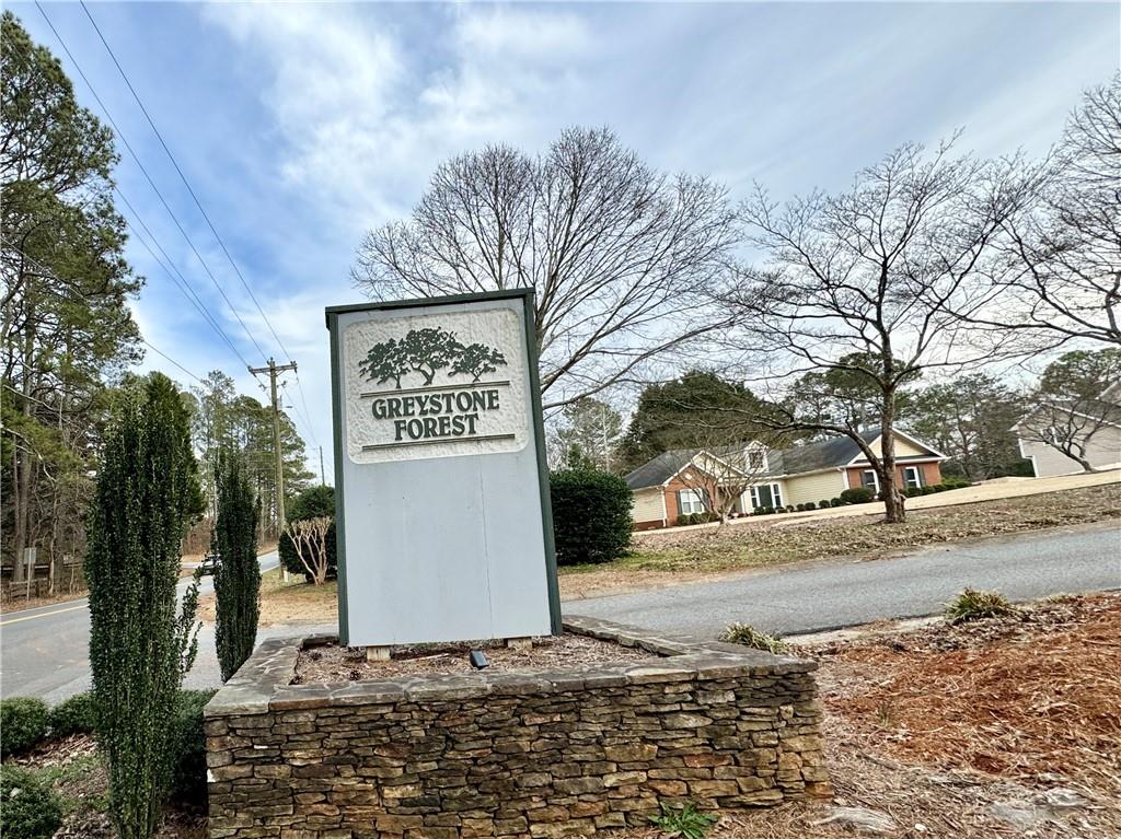 1680 Greystone Road Cumming, GA 30040 - Photo 6 of 9 a sign board with parking space