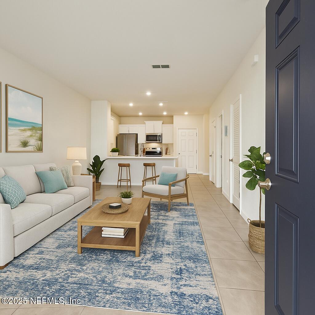 86752 Shortline Circle Yulee, FL 32097 - Photo 14 of 40 Coastal-Inspired Living Room and Kitchen
