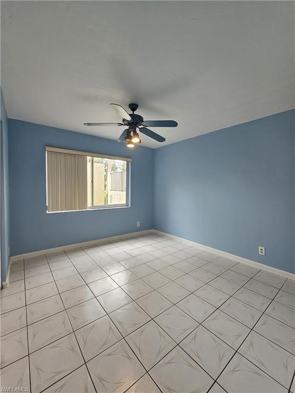 4140 Looking Glass Lane, Unit 5 Naples, FL 34112 - Photo 13 of 24 a view of an empty room and window