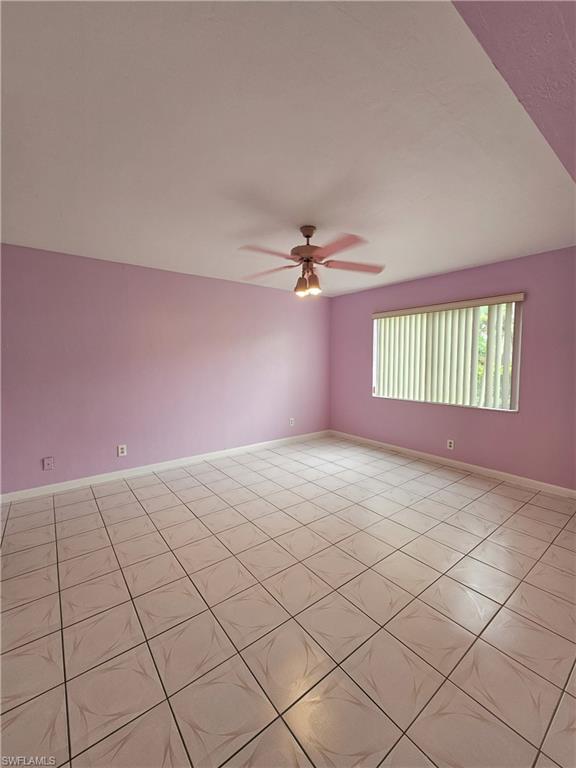 4140 Looking Glass Lane, Unit 5 Naples, FL 34112 - Photo 17 of 24 a view of an empty room and window