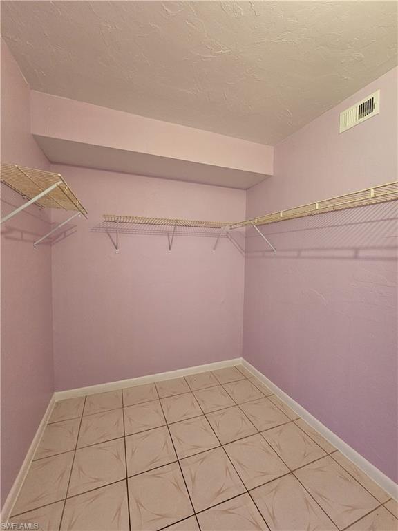4140 Looking Glass Lane, Unit 5 Naples, FL 34112 - Photo 20 of 24 a view of a room with racks on the wall