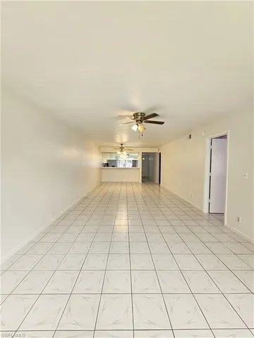 a kitchen with a stove sink and cabinets