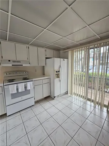 a view of a kitchen with a sink