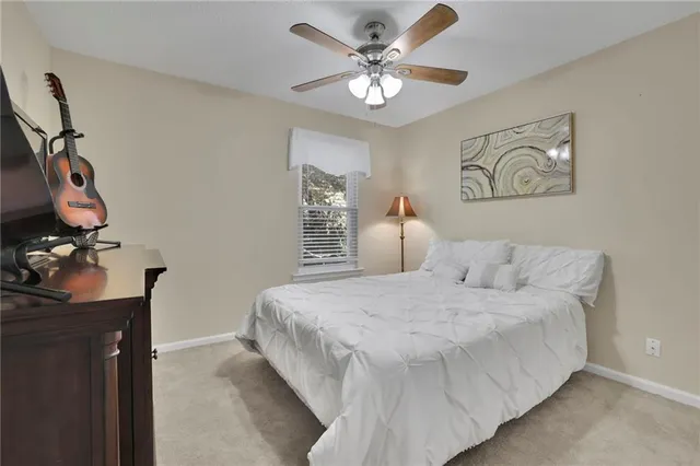 a large white bed in a white room