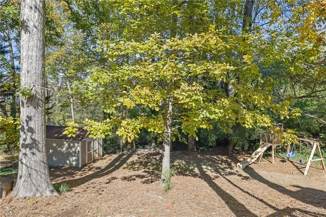 a view of a patio with a table and chairs