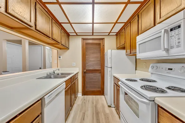 a kitchen with a stove and a refrigerator