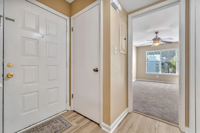 a view of staircase with white walls