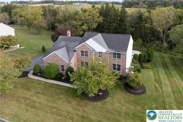 an aerial view of a house with a garden