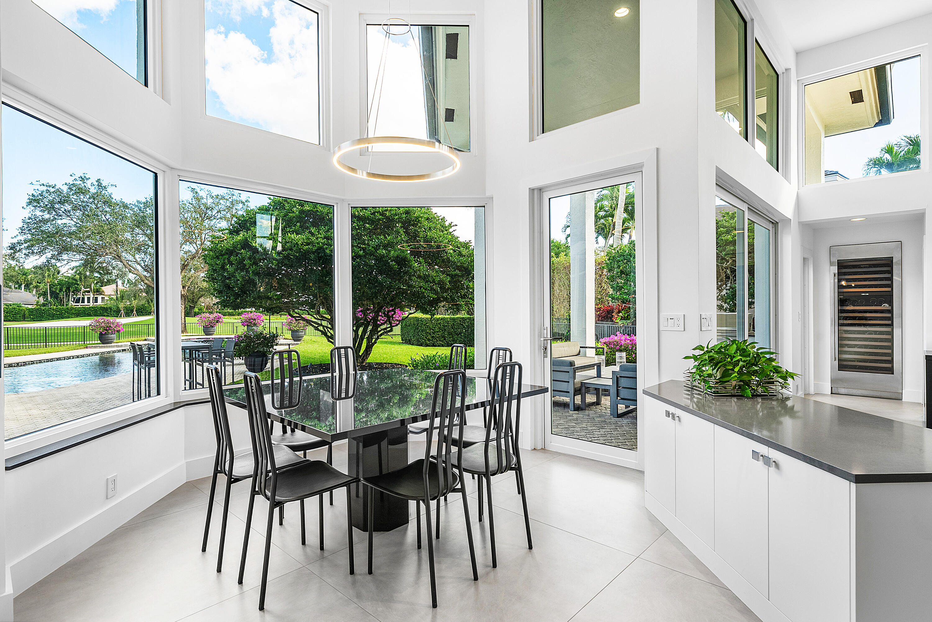 3710 Northwest 53rd Street Boca Raton, FL 33496 - Photo 15 of 42 a view of a dining room with furniture window and outside view