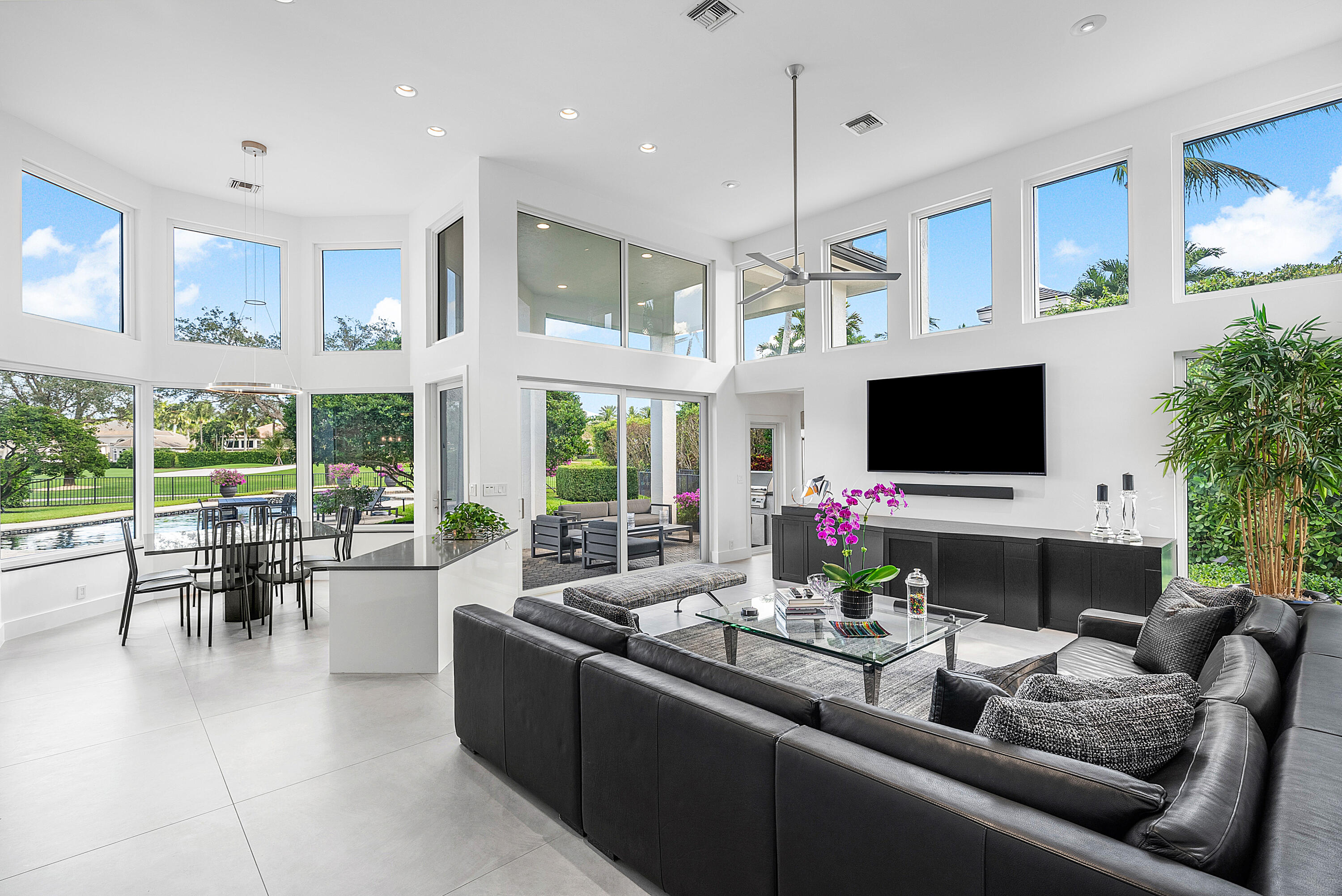 3710 Northwest 53rd Street Boca Raton, FL 33496 - Photo 17 of 42 a living room with furniture and a flat screen tv