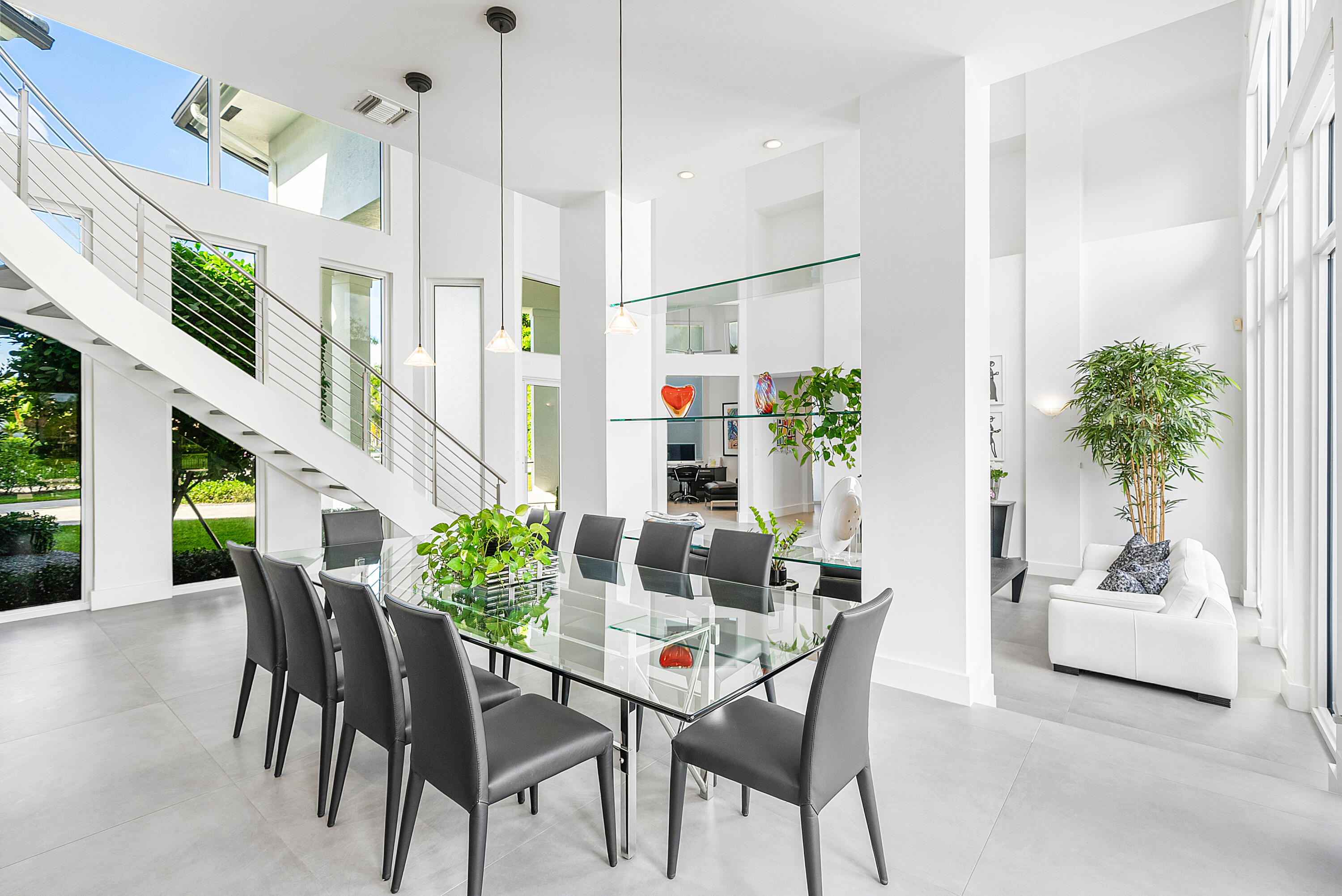 3710 Northwest 53rd Street Boca Raton, FL 33496 - Photo 21 of 42 a view of a dining room with furniture and potted plant