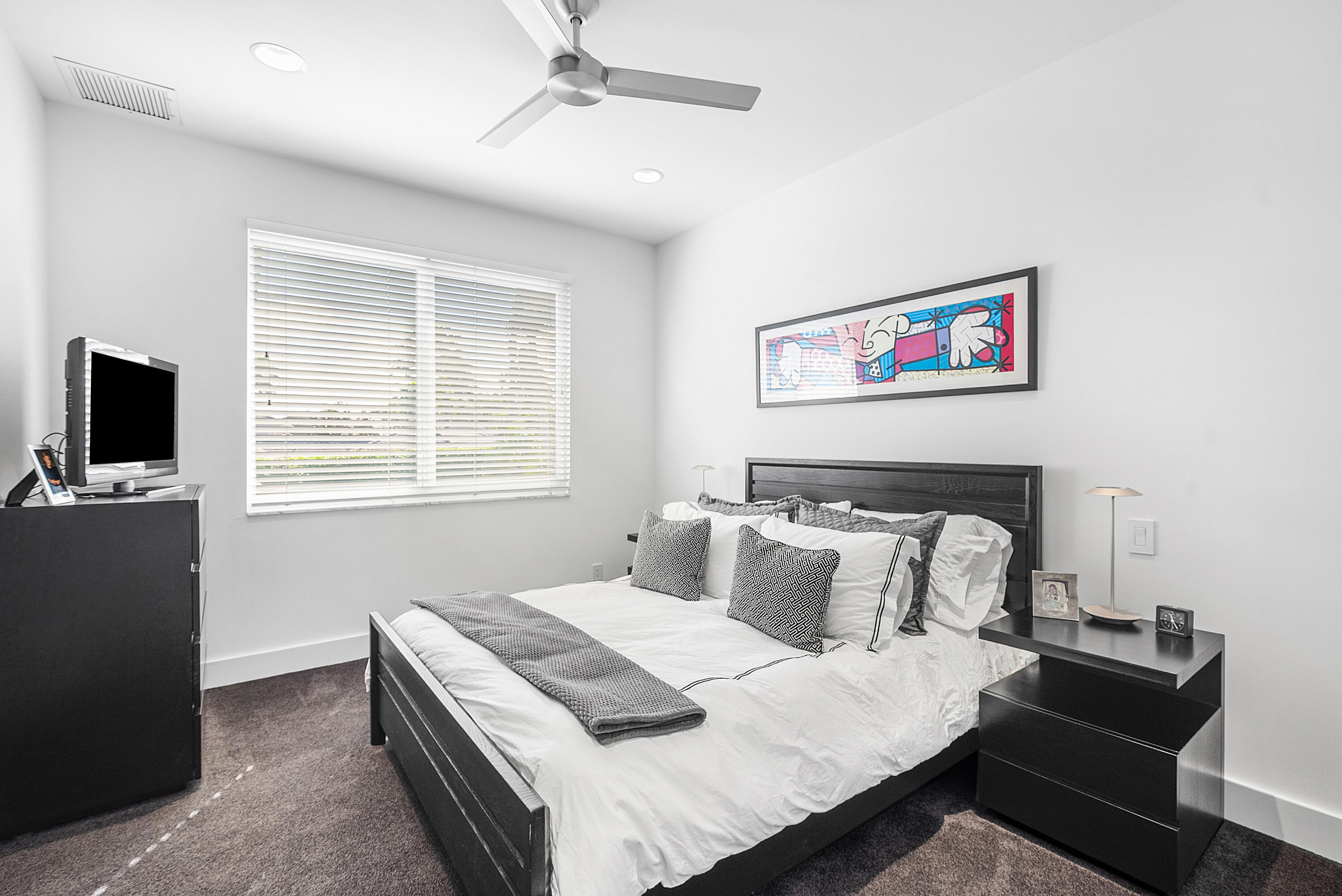 3710 Northwest 53rd Street Boca Raton, FL 33496 - Photo 26 of 42 a bedroom with a bed and a tv