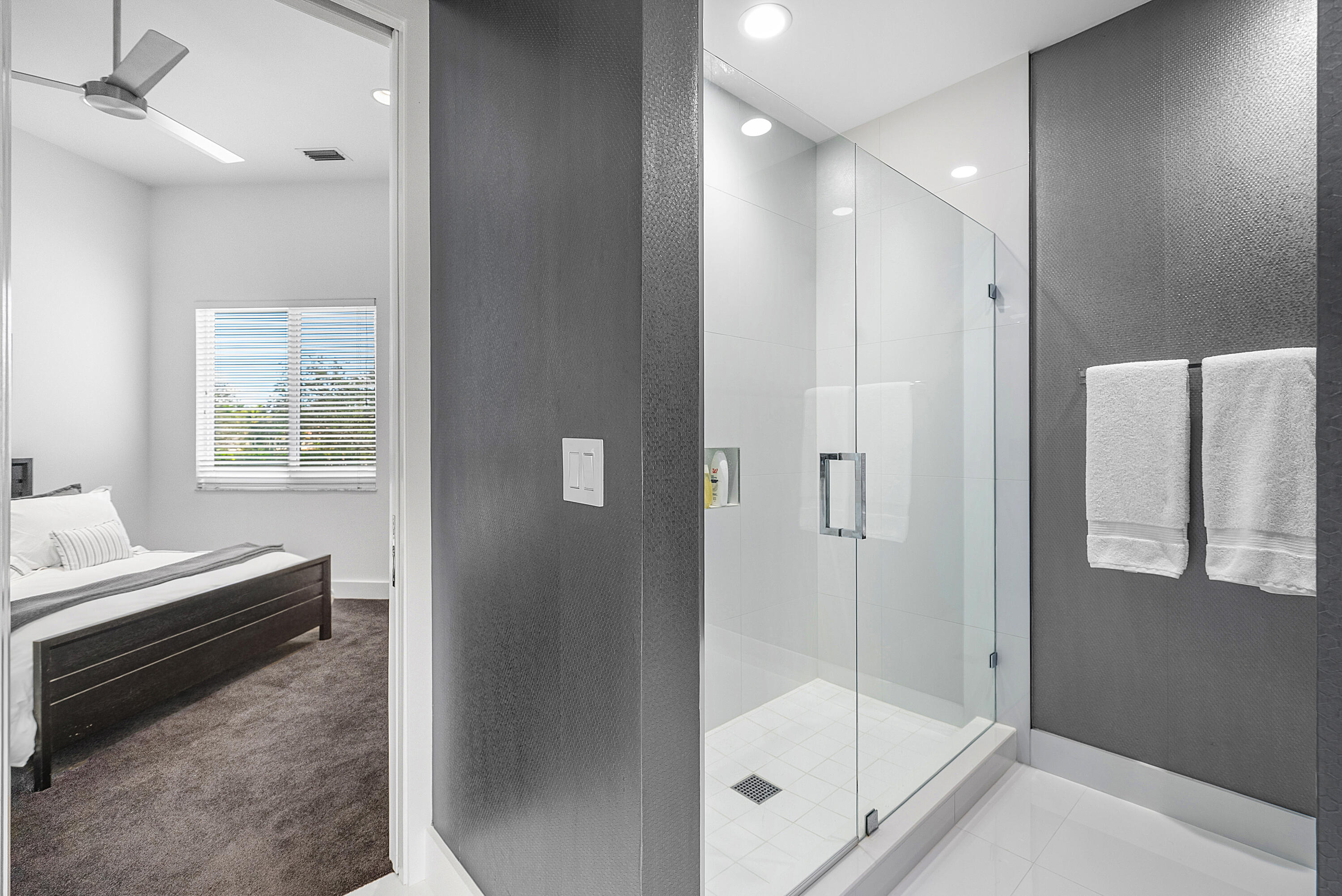 3710 Northwest 53rd Street Boca Raton, FL 33496 - Photo 30 of 42 a bathroom with a tub and shower