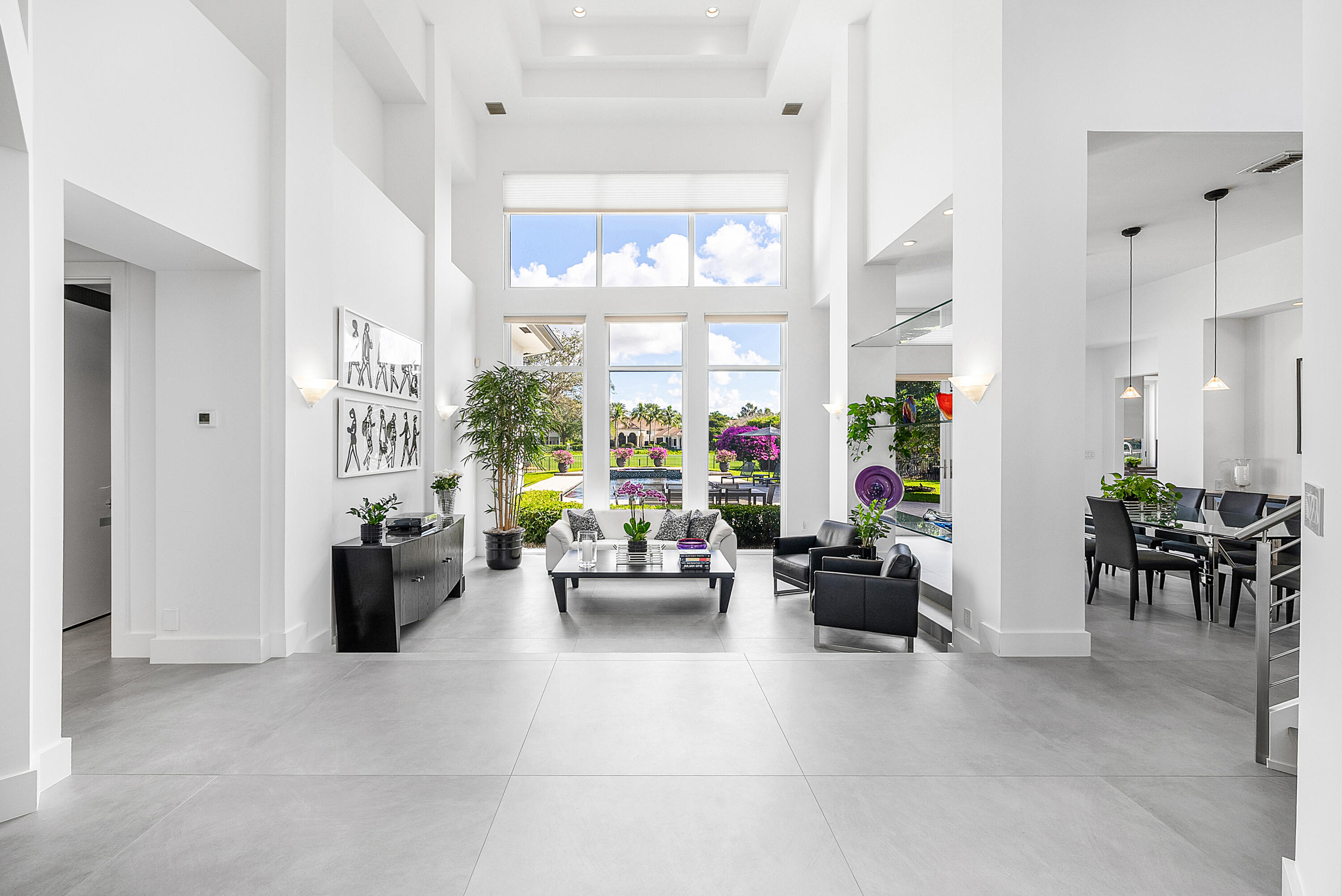 3710 Northwest 53rd Street Boca Raton, FL 33496 - Photo 3 of 42 a living room with furniture and a large window