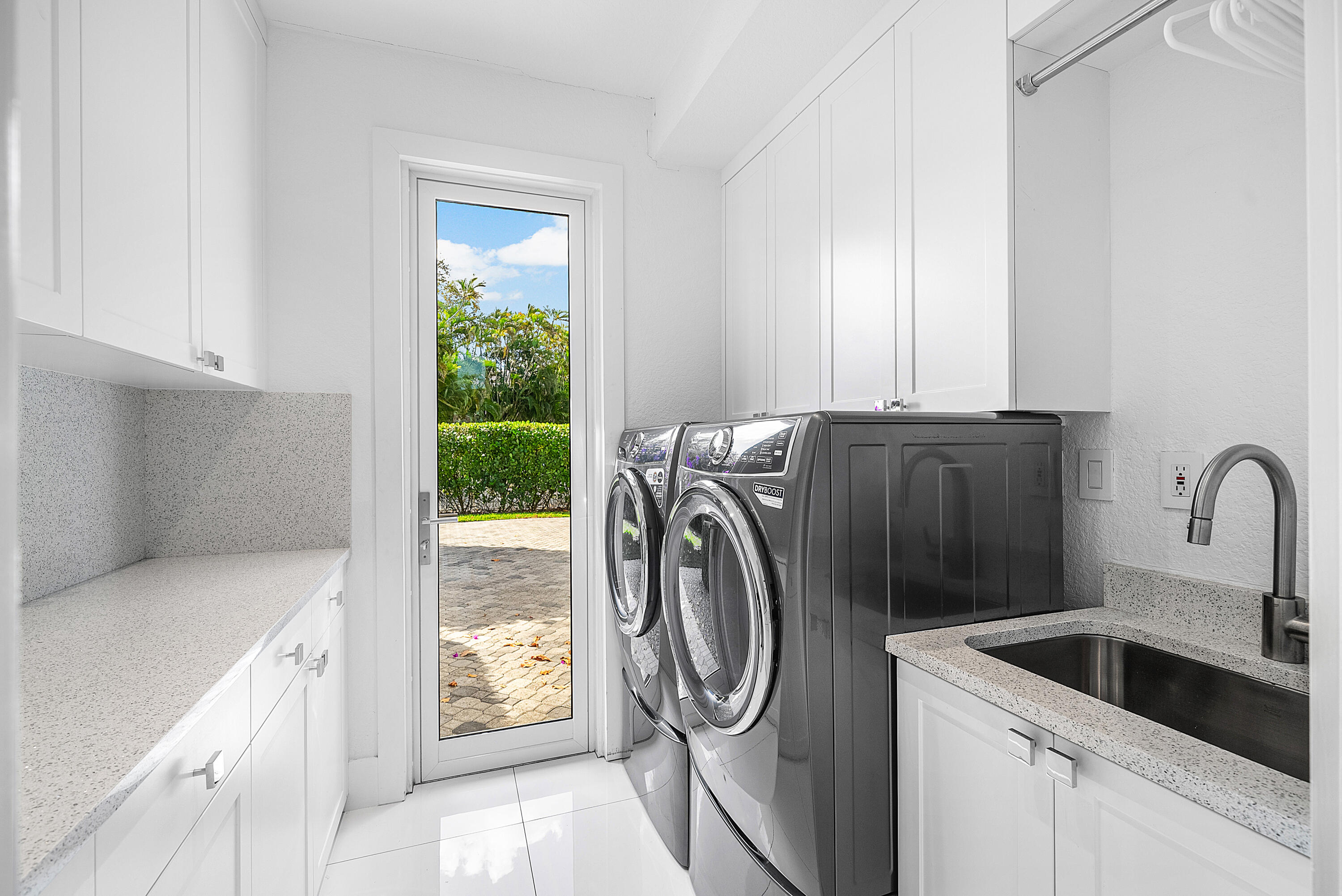 3710 Northwest 53rd Street Boca Raton, FL 33496 - Photo 33 of 42 a utility room with sink dryer and washer