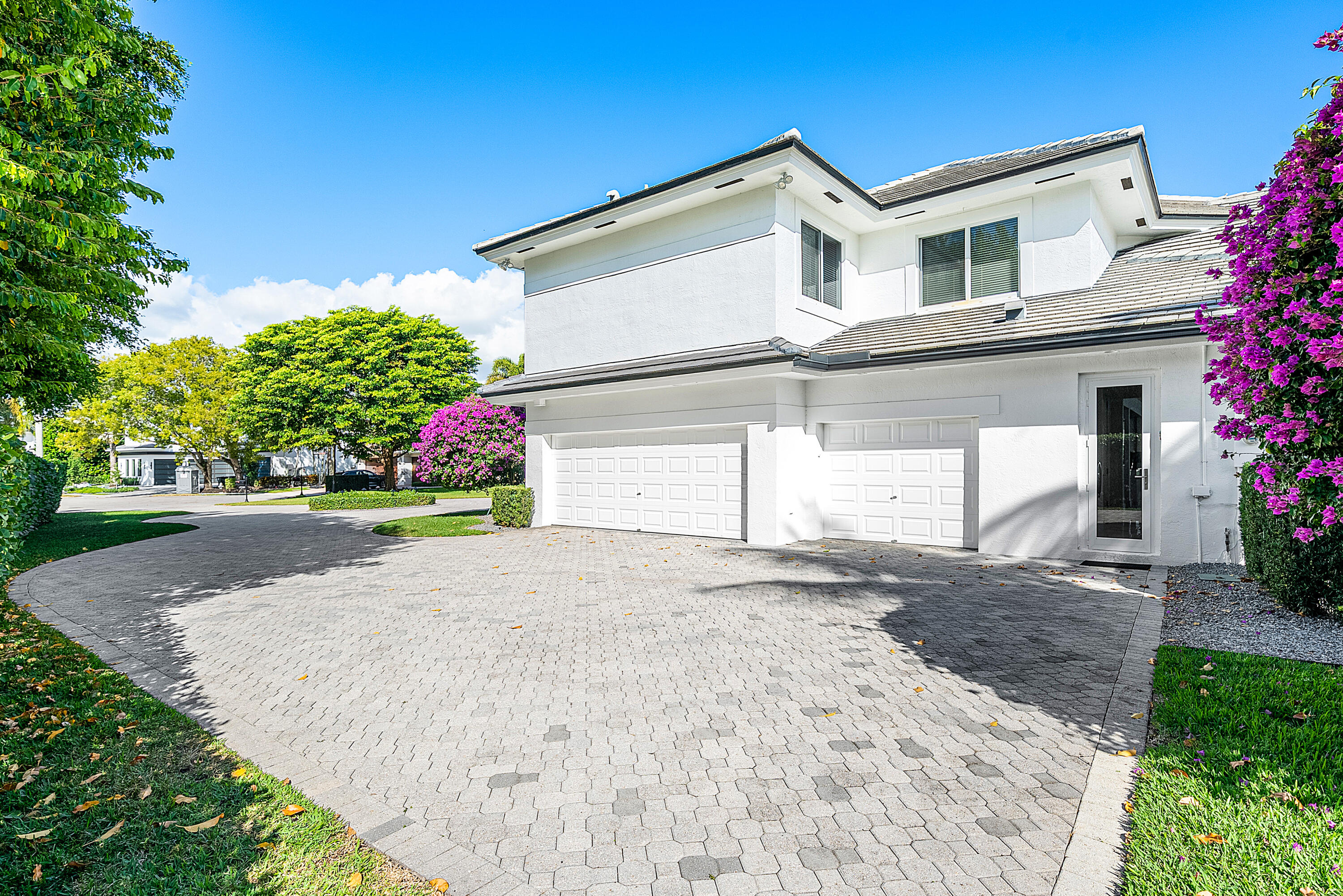 3710 Northwest 53rd Street Boca Raton, FL 33496 - Photo 34 of 42 a front view of a house with a yard and a garage