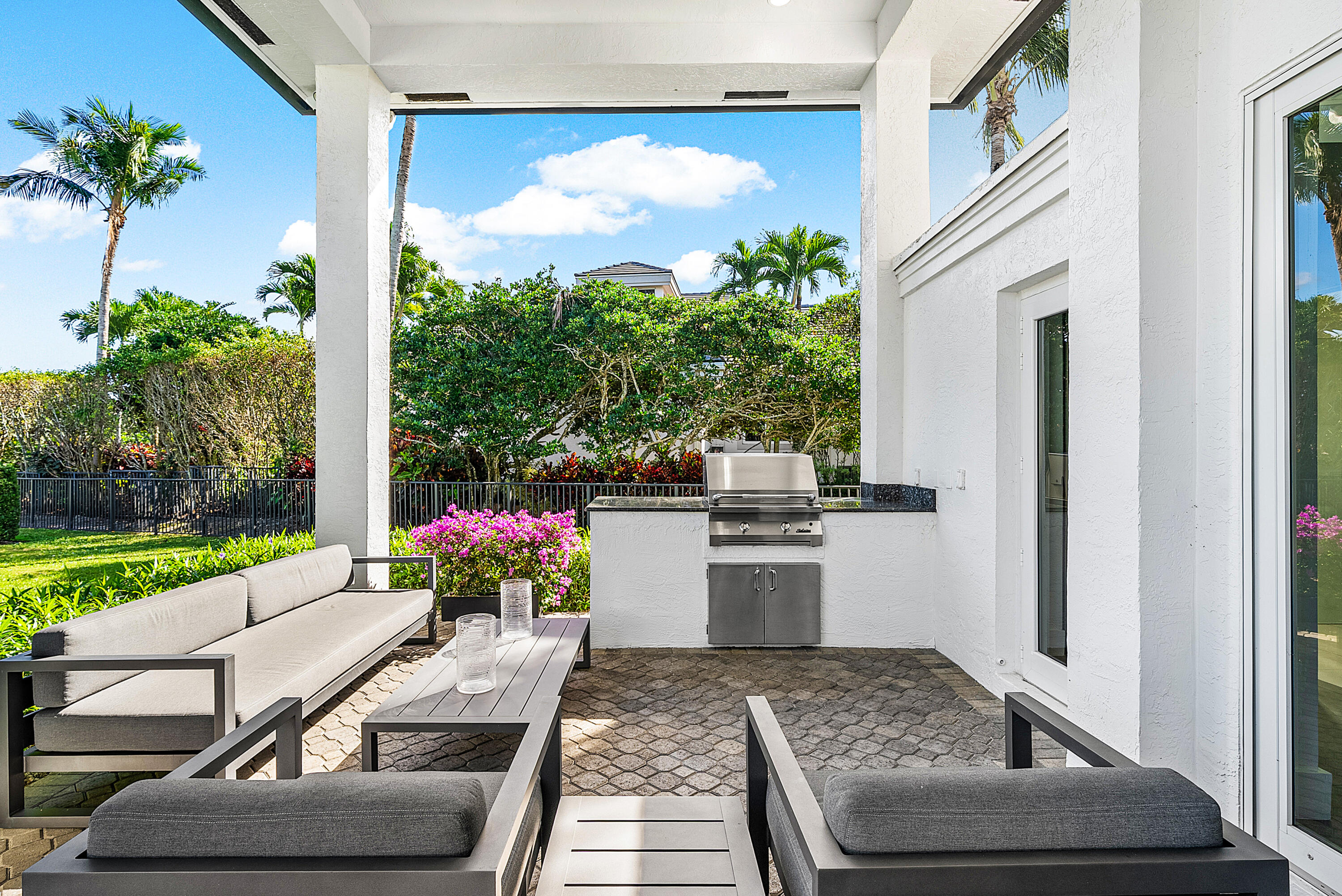 3710 Northwest 53rd Street Boca Raton, FL 33496 - Photo 35 of 42 a room with patio furniture and a potted plant