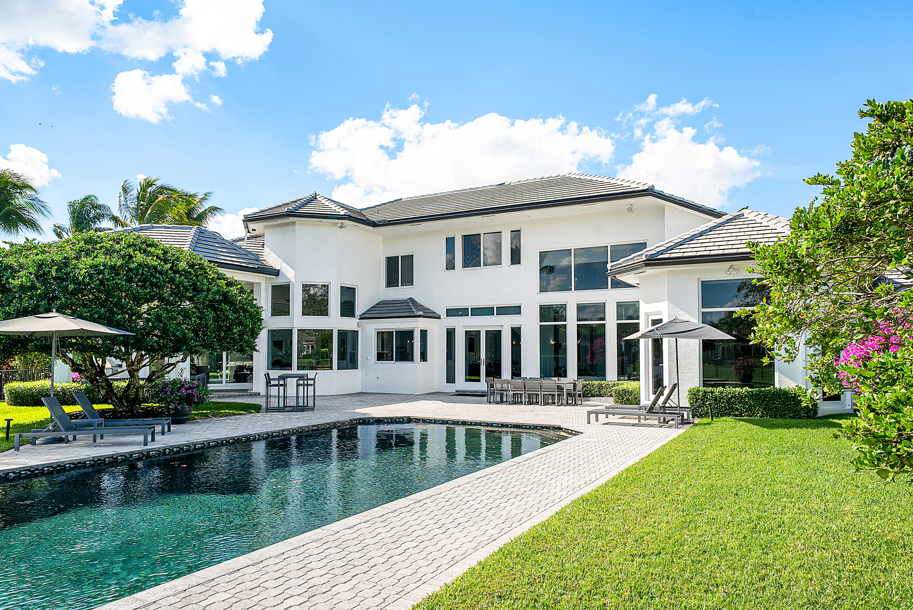 3710 Northwest 53rd Street Boca Raton, FL 33496 - Photo 38 of 42 a front view of a house with garden