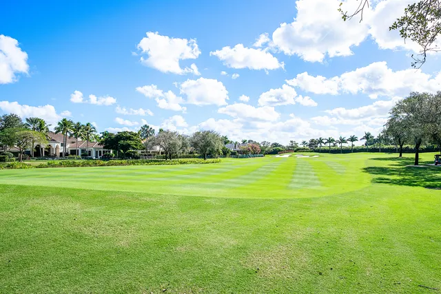 an aerial view of a house a yard and outdoor seating