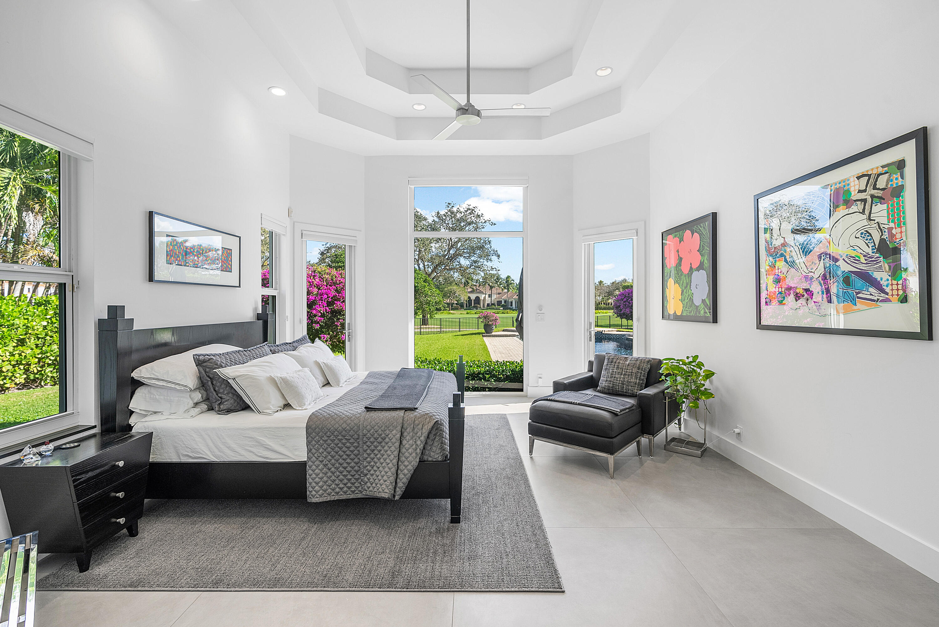 3710 Northwest 53rd Street Boca Raton, FL 33496 - Photo 6 of 42 a living room with furniture large window and a flat screen tv