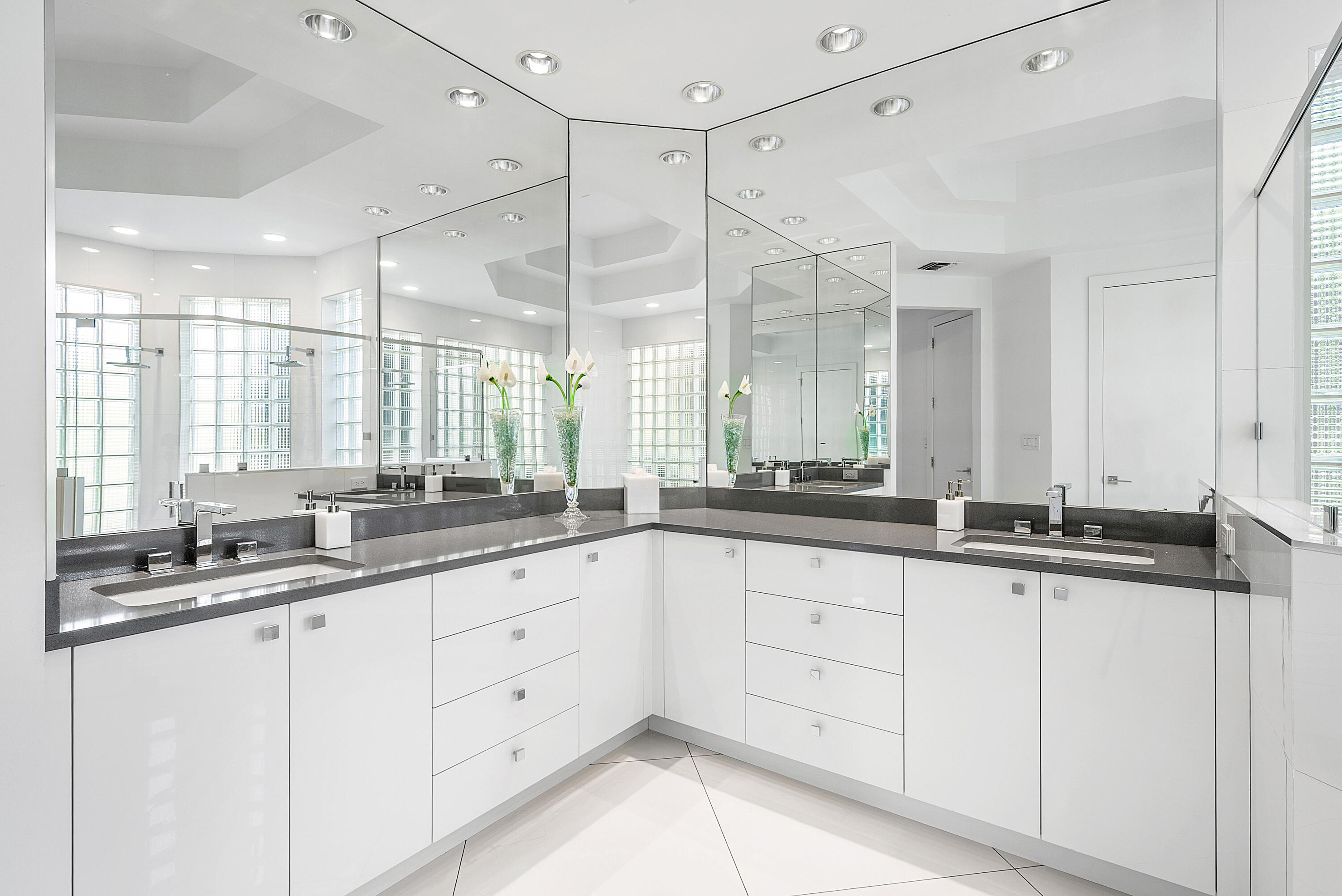 3710 Northwest 53rd Street Boca Raton, FL 33496 - Photo 7 of 42 a bathroom with double sink and a mirror