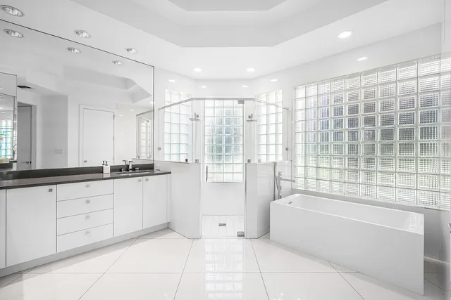 a bathroom with a bathtub and a sink