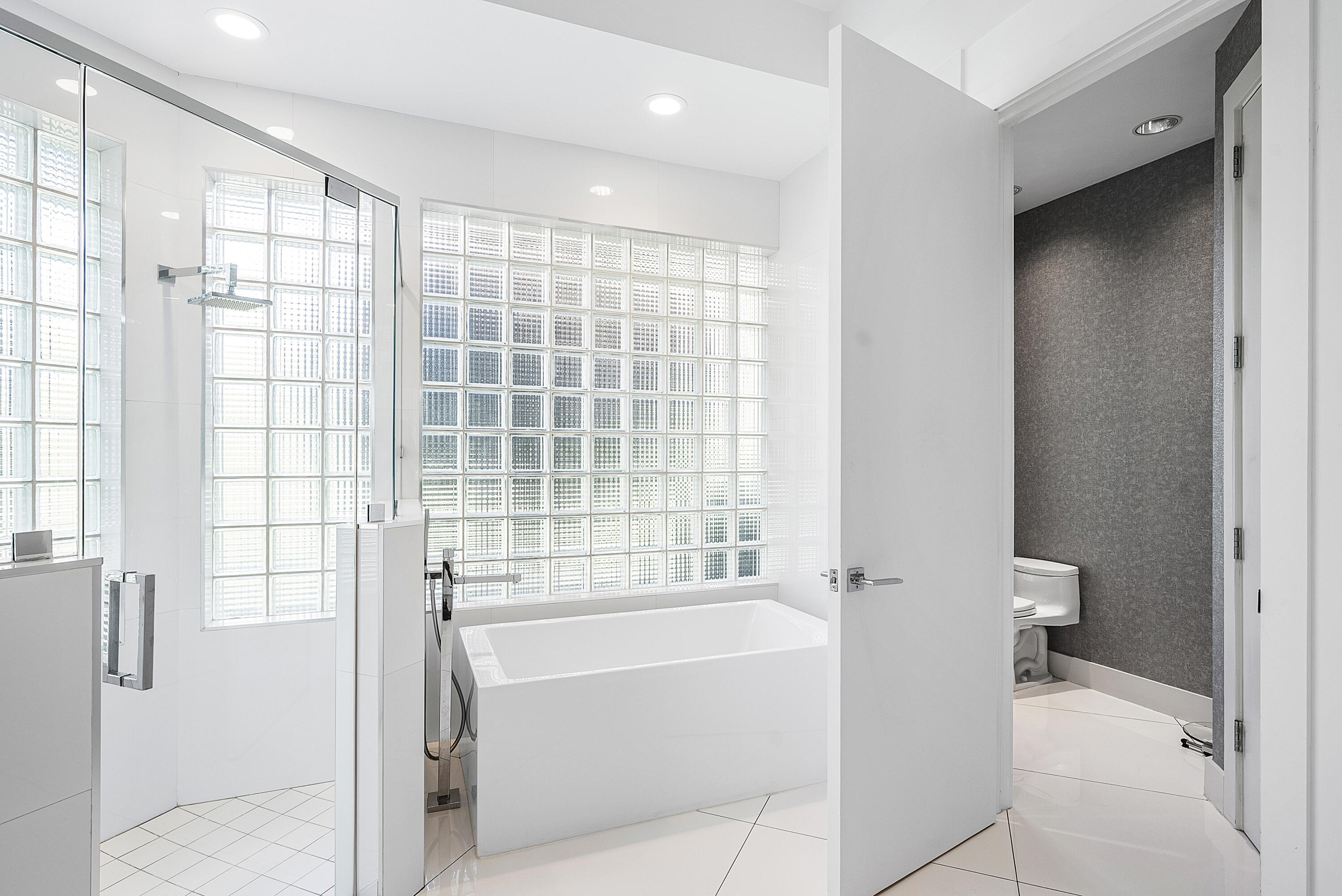 3710 Northwest 53rd Street Boca Raton, FL 33496 - Photo 9 of 42 a bathroom with a bathtub and a shower