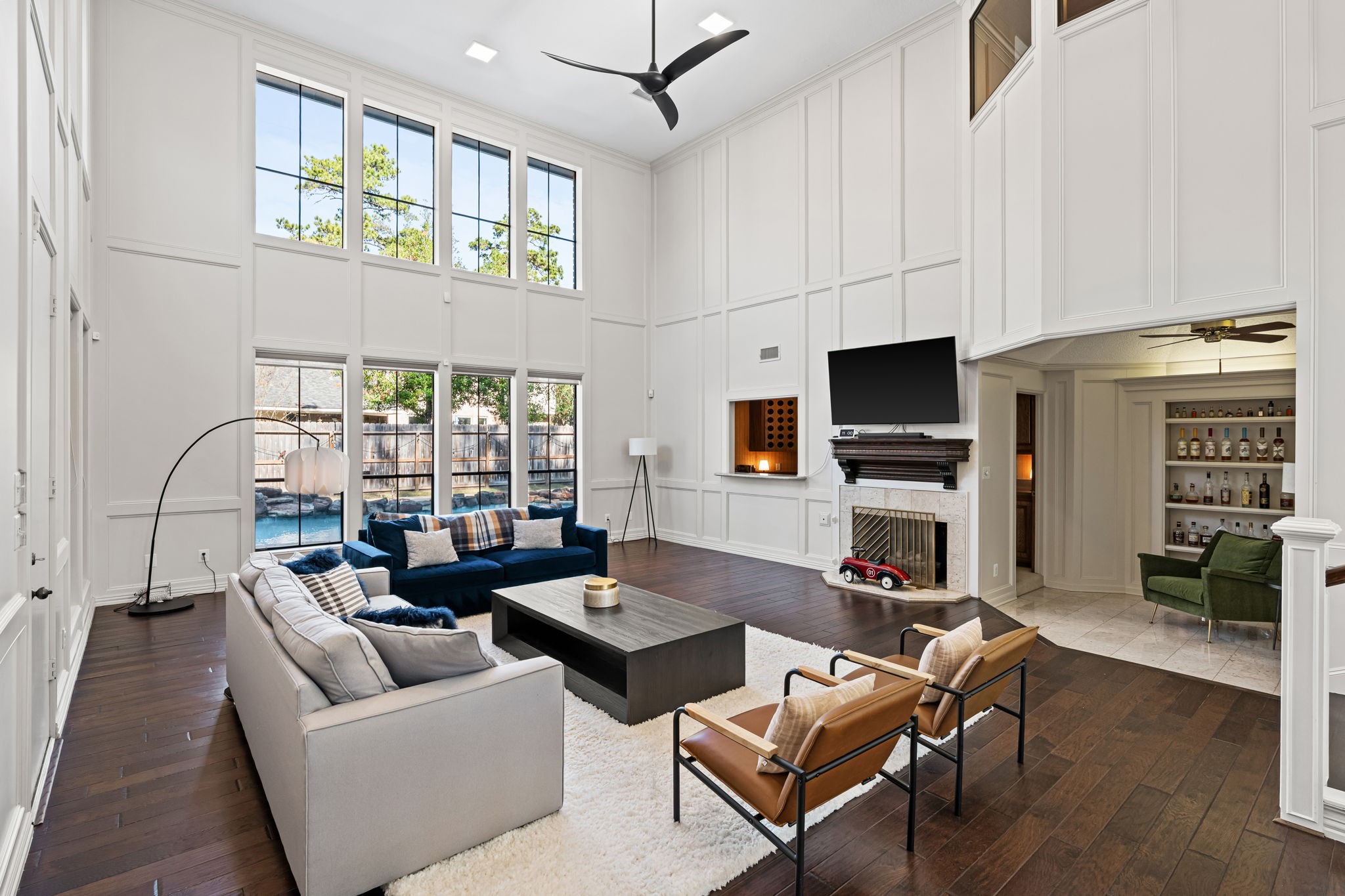 9410 Windrush Drive Spring, TX 77379 - Photo 12 of 50 a living room with fireplace furniture and a flat screen tv