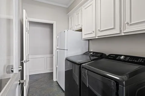 a kitchen with a stove and a refrigerator