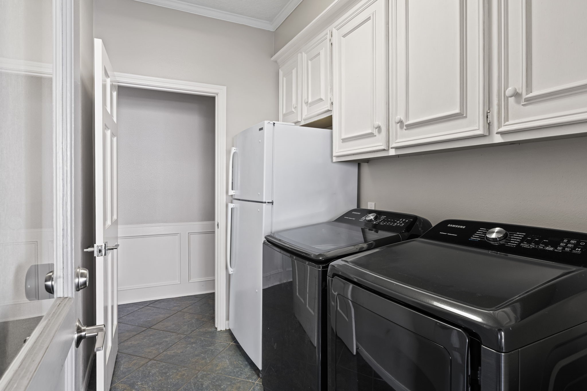 9410 Windrush Drive Spring, TX 77379 - Photo 16 of 50 a kitchen with a stove and a refrigerator