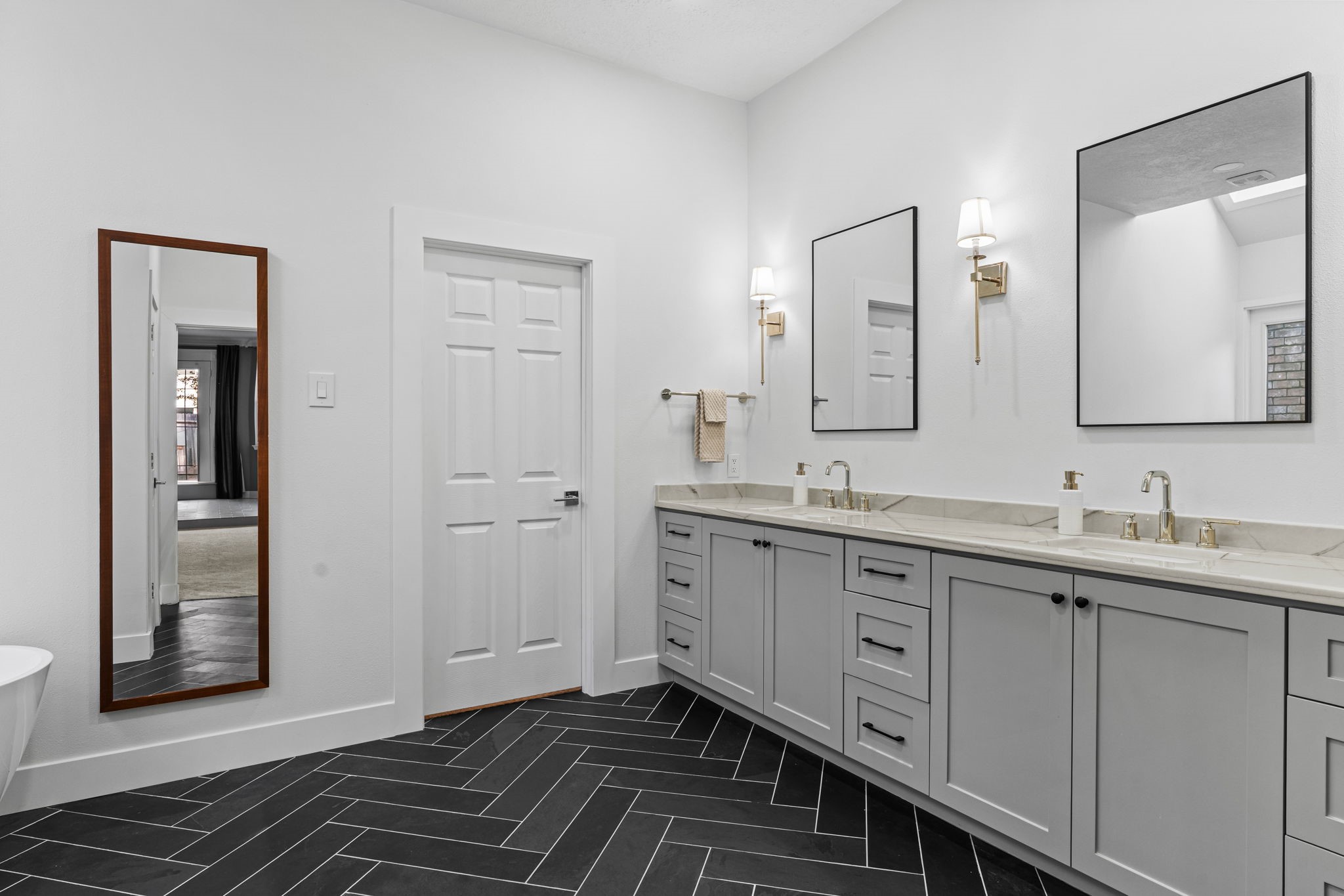 9410 Windrush Drive Spring, TX 77379 - Photo 21 of 50 a spacious bathroom with a double vanity sink and a mirror