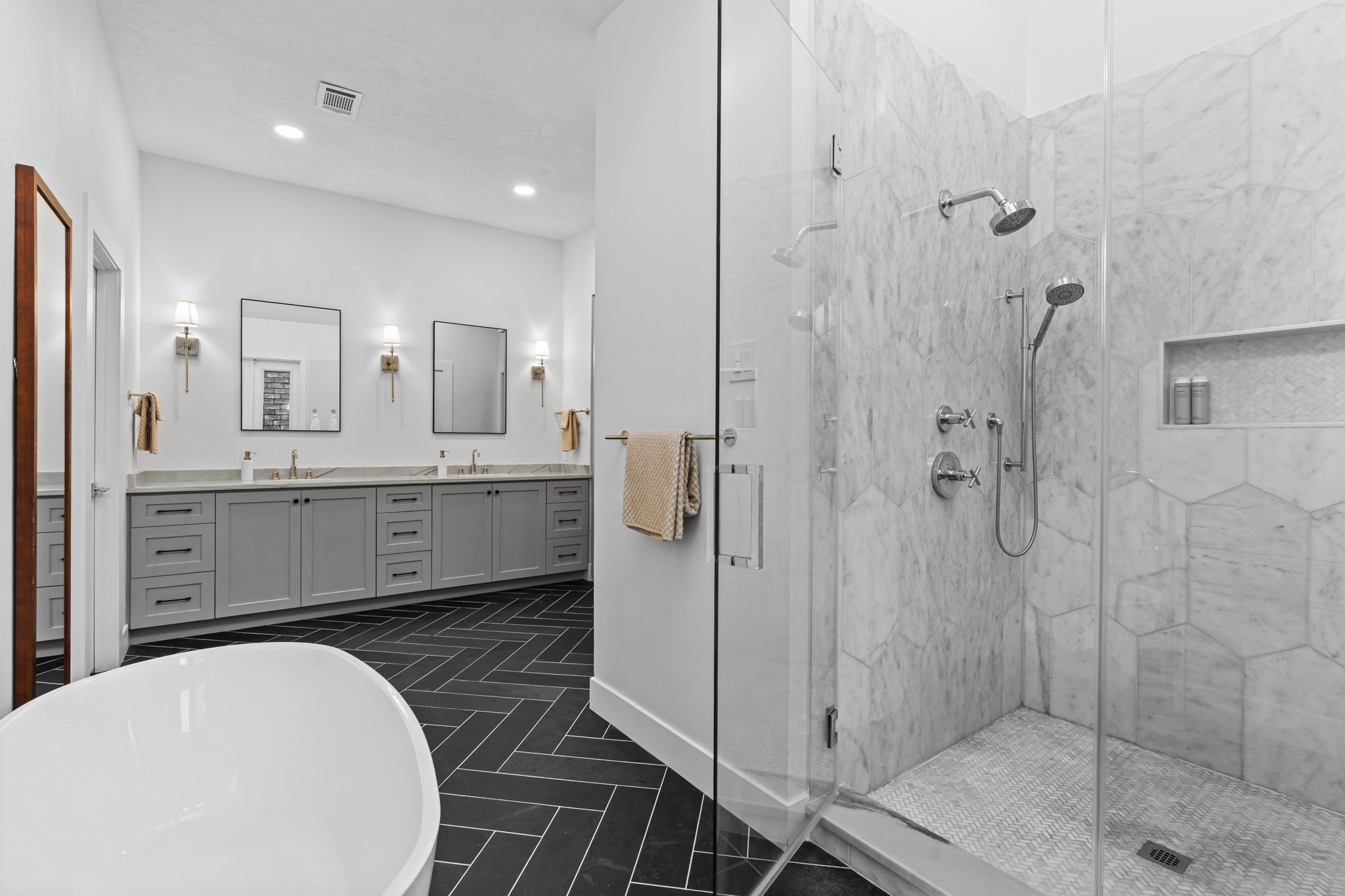 9410 Windrush Drive Spring, TX 77379 - Photo 24 of 50 a bathroom with a double vanity sink toilet and shower
