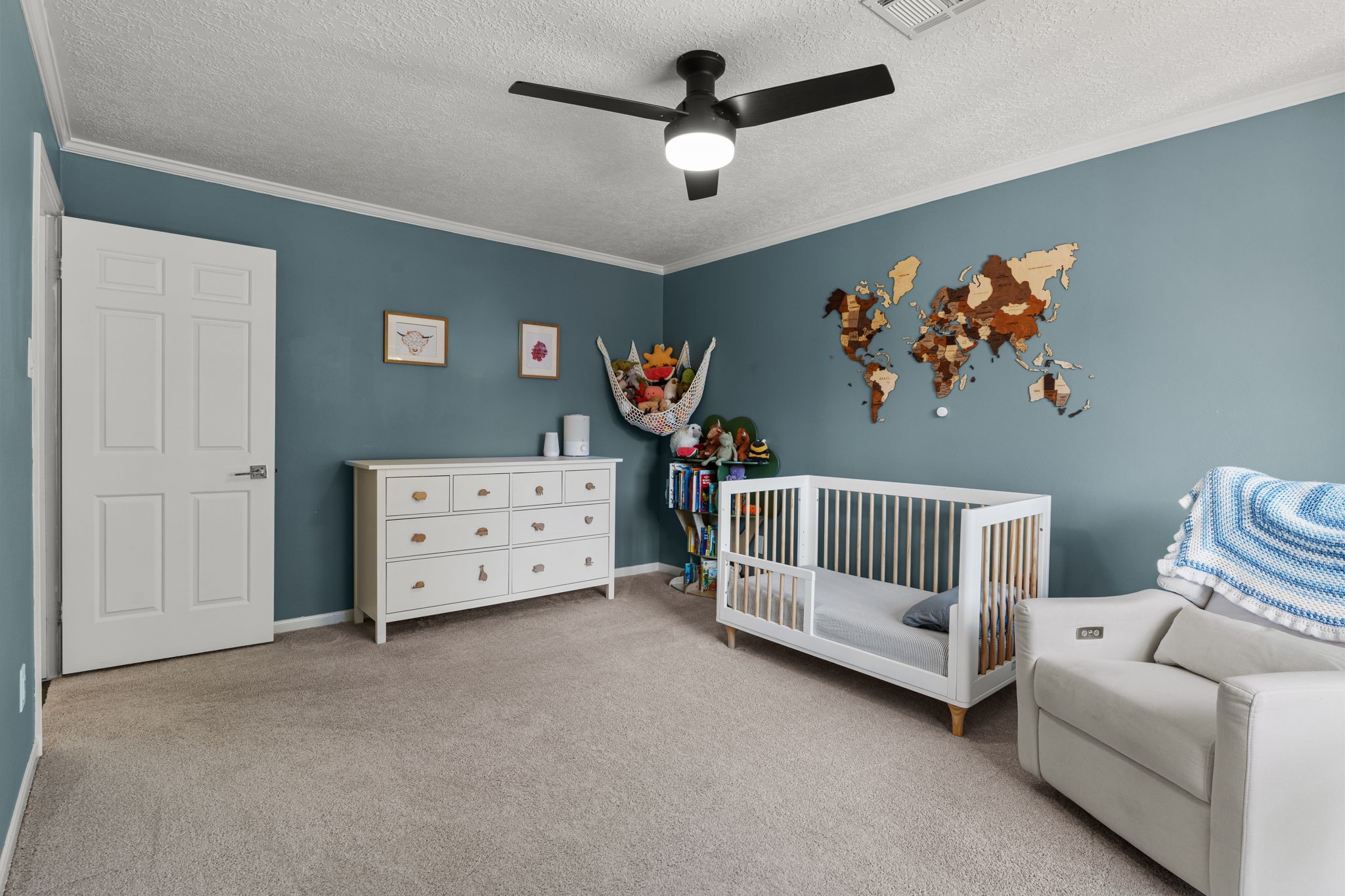 9410 Windrush Drive Spring, TX 77379 - Photo 34 of 50 a bedroom with furniture and a chandelier