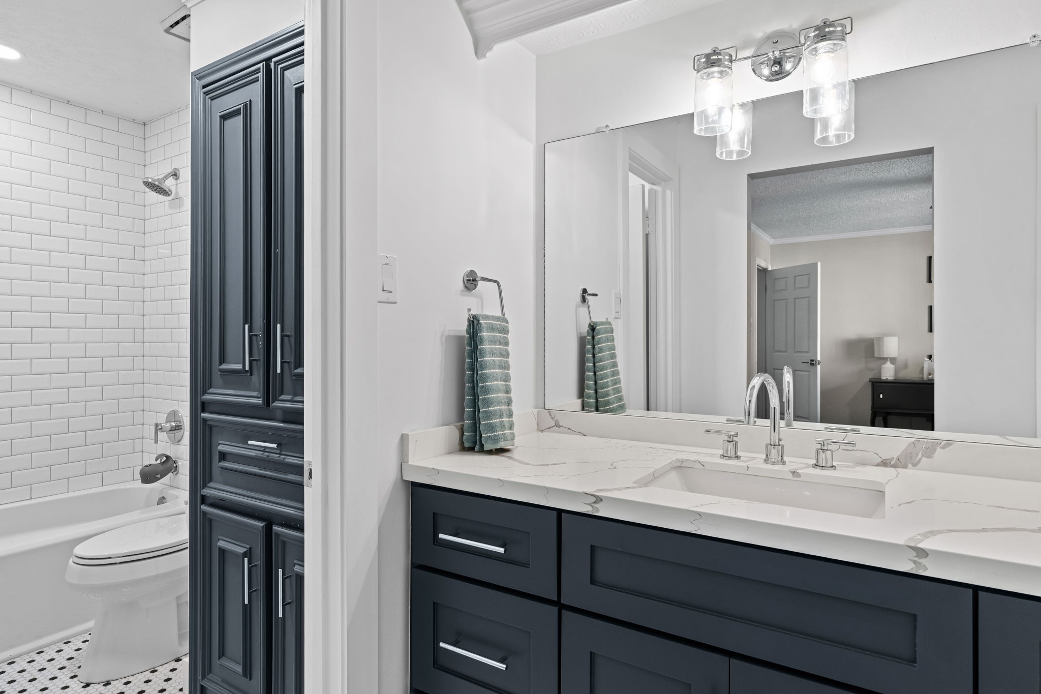 9410 Windrush Drive Spring, TX 77379 - Photo 36 of 50 a bathroom with a toilet a sink and a mirror